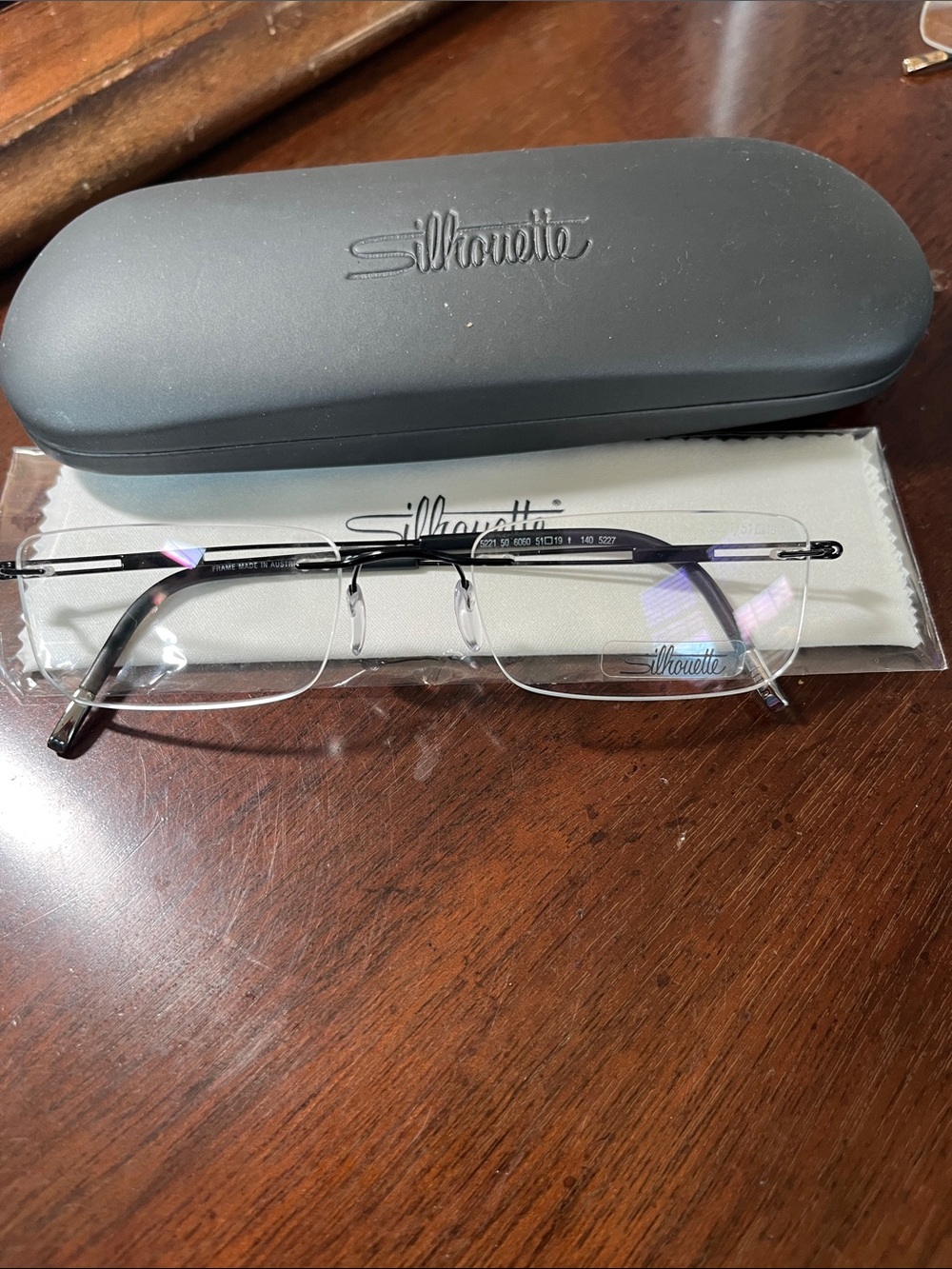 Silhouette Men’s Rimless 5221 6050 51/19/140 - Black Frame with demo Lenses